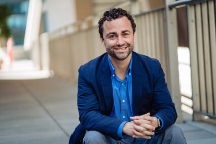Matt Oppeheimer sitting with hands folded
